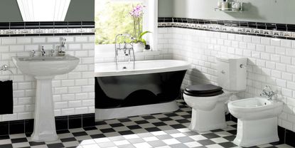 Black bathroom ideas: Art deco style black and white tiles with black bath tub by Original Style