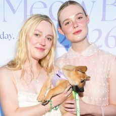Sisters Dakota and Elle Fanning coordinated in the slouchy pouch bag trend 