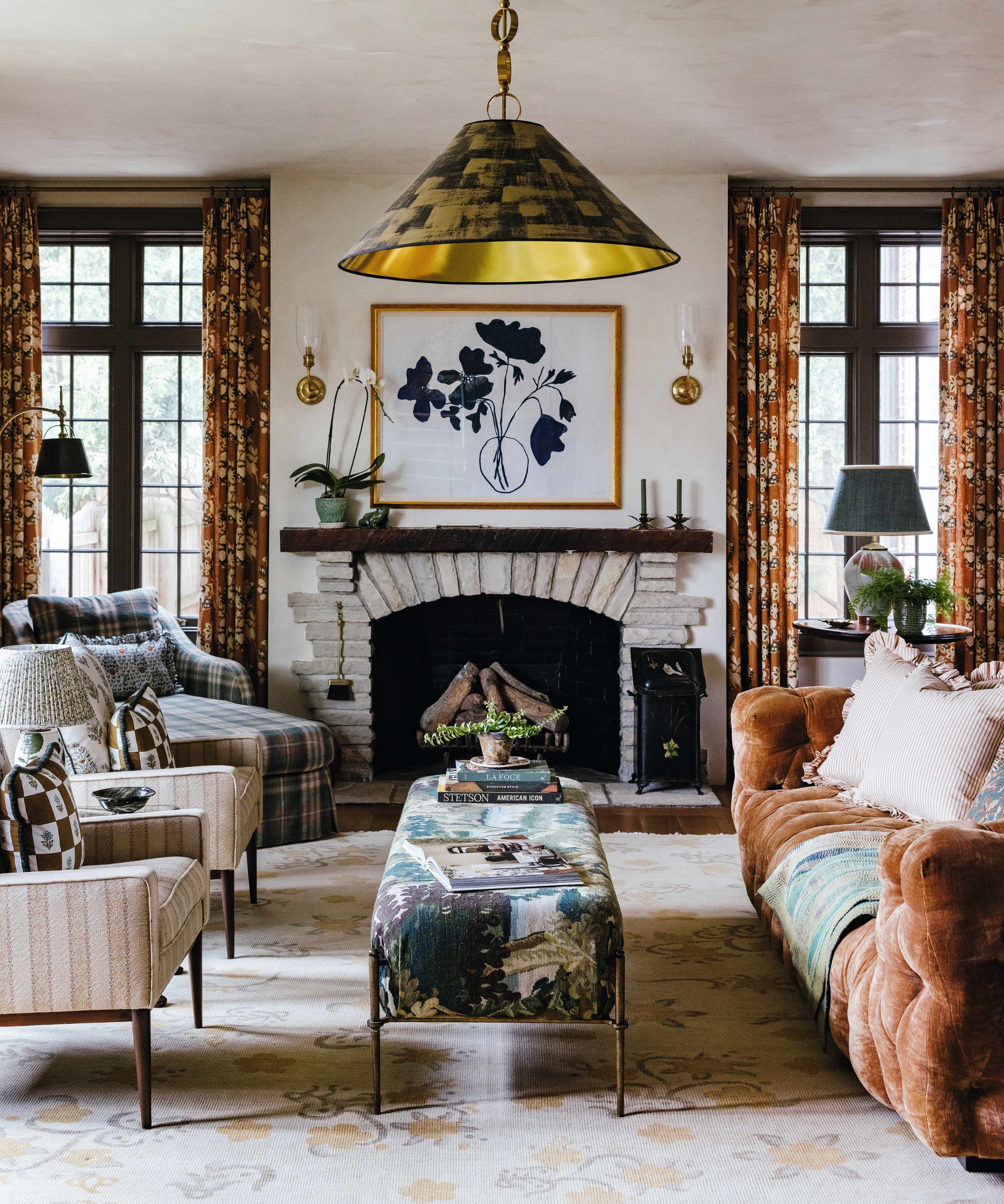 a layered vintage style living room with a rust and green palette