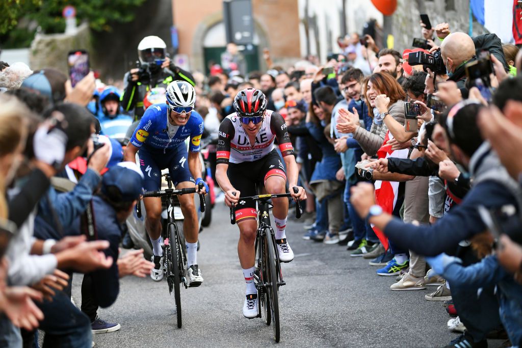 BERGAMO ITALY OCTOBER 09 LR Fausto Masnada of Italy and Team Deceuninck QuickStep and Tadej Pogacar of Slovenia and UAE Team Emirates compete in the breakaway while fans cheer during the 115th Il Lombardia 2021 a 239km race from Como to Bergamo ilombardia UCIWT on October 09 2021 in Bergamo Italy Photo by Tim de WaeleGetty Images