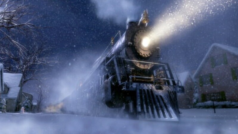 A still from The Polar Express, showing the train lighting up a snowy night