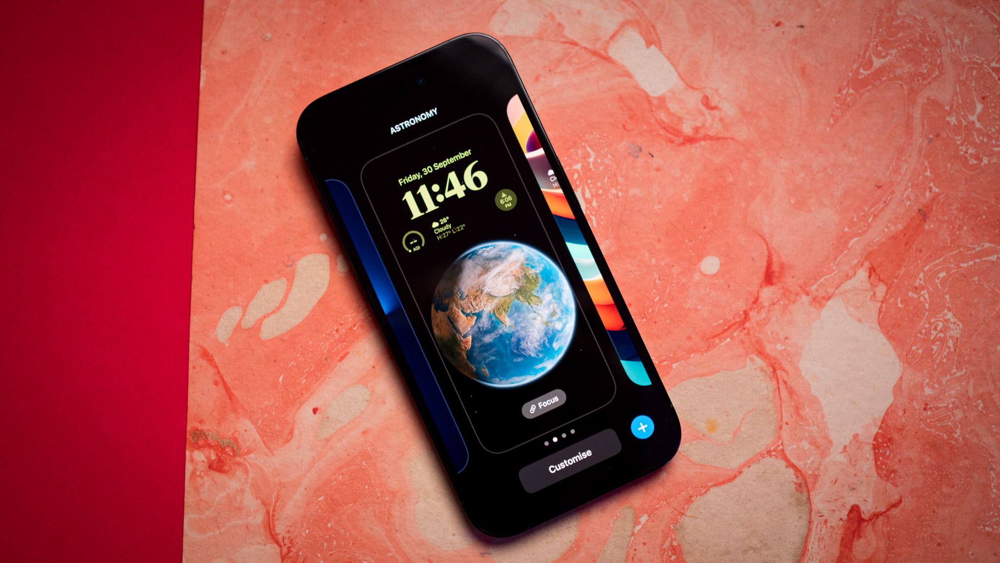 iPhone 14 Pro lock screen customization on red background