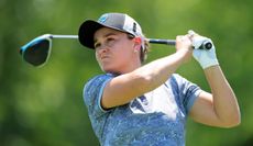 Ash Barty hits a tee shot with a driver and watches the flight
