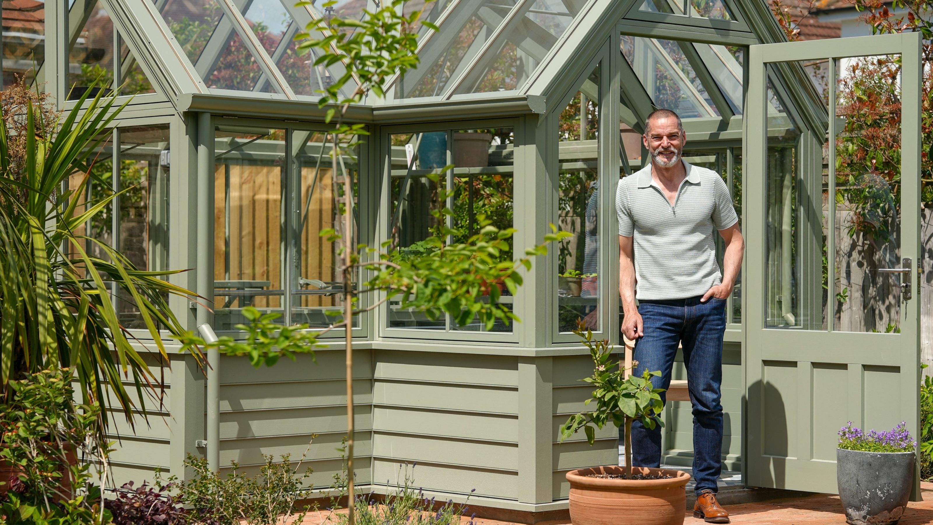 Fred Sirieix standing outside of Hampton The Causeway greenhouse