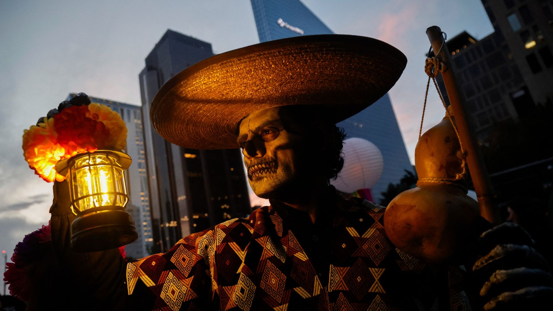 
                                A man in costume takes part in Mexico City’s Catrinas Parade ahead of the Day of the Dead celebrations
                            