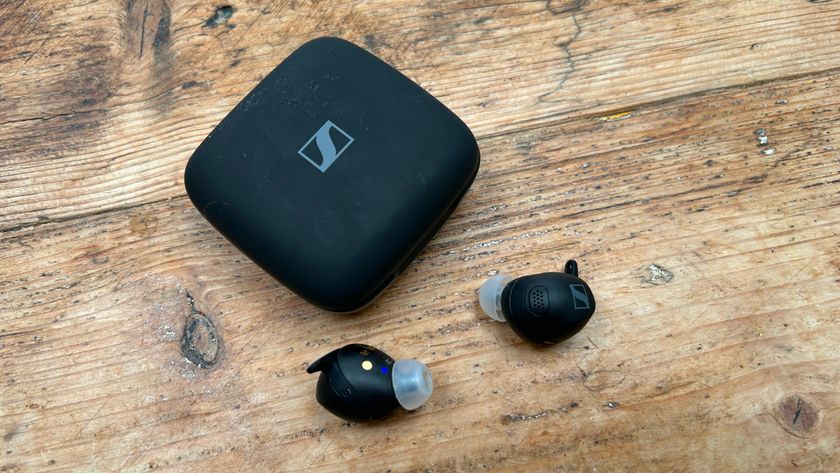 Sennheiser Momentum Sport earbuds next to case