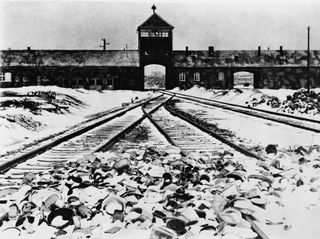 Train tracks converge at the entrance to the Nazi death camp, Auschwitz-Birkenau.