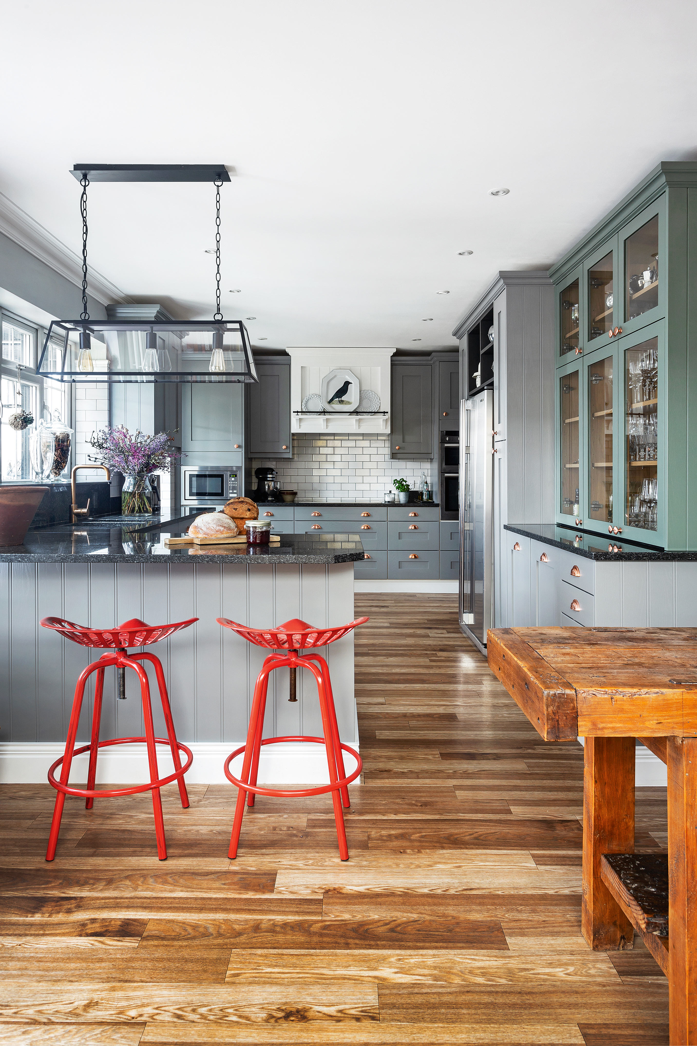 Grey kitchen with green cabinets