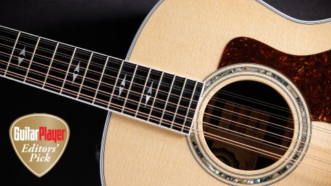 A photo of the Taylor 50th Anniversary 858e LTD 12-string acoustic with the Guitar Player Editors&#039; Pick logo