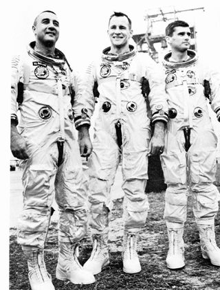 Black and white photo. Astronauts for the first Apollo Mission (L-R) Virgil I. Grissom, Edward H. White and Roger B. Chaffee