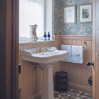 Downstairs bathroom with wall panelling and wallpaper