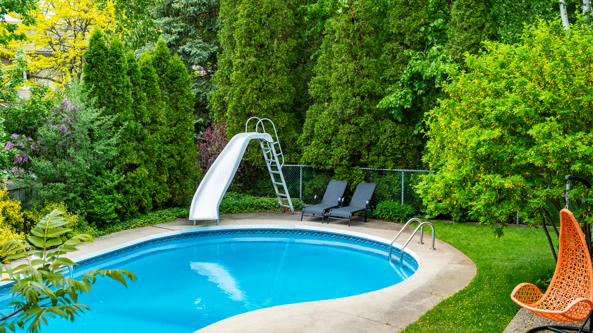 backyard with pool and slide 