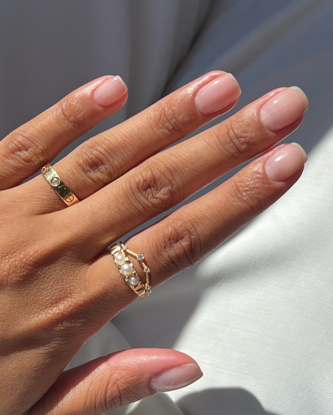 A milky white manicure by Iram Shelton