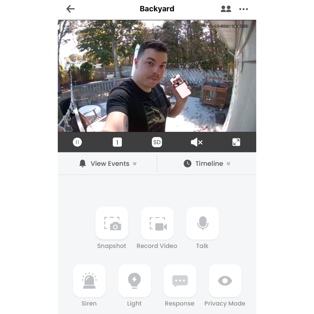 App view on the Lorex 4K Spotlight Indoor/Outdoor Camera, one of the best pet cameras, with Thomas in the shot