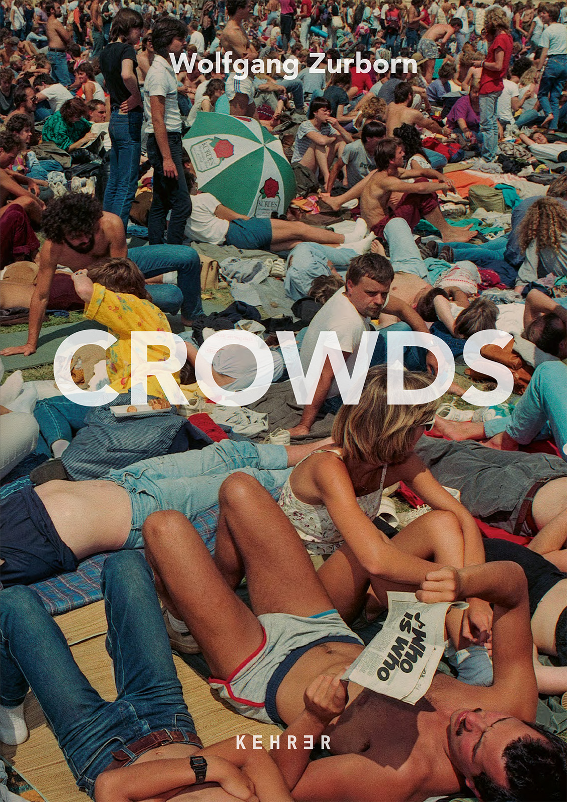 The cover of Crowds shows a dense, sun-drenched crowd of festivalgoers lying and sitting on the ground, with the title overlaid in white across the scene.