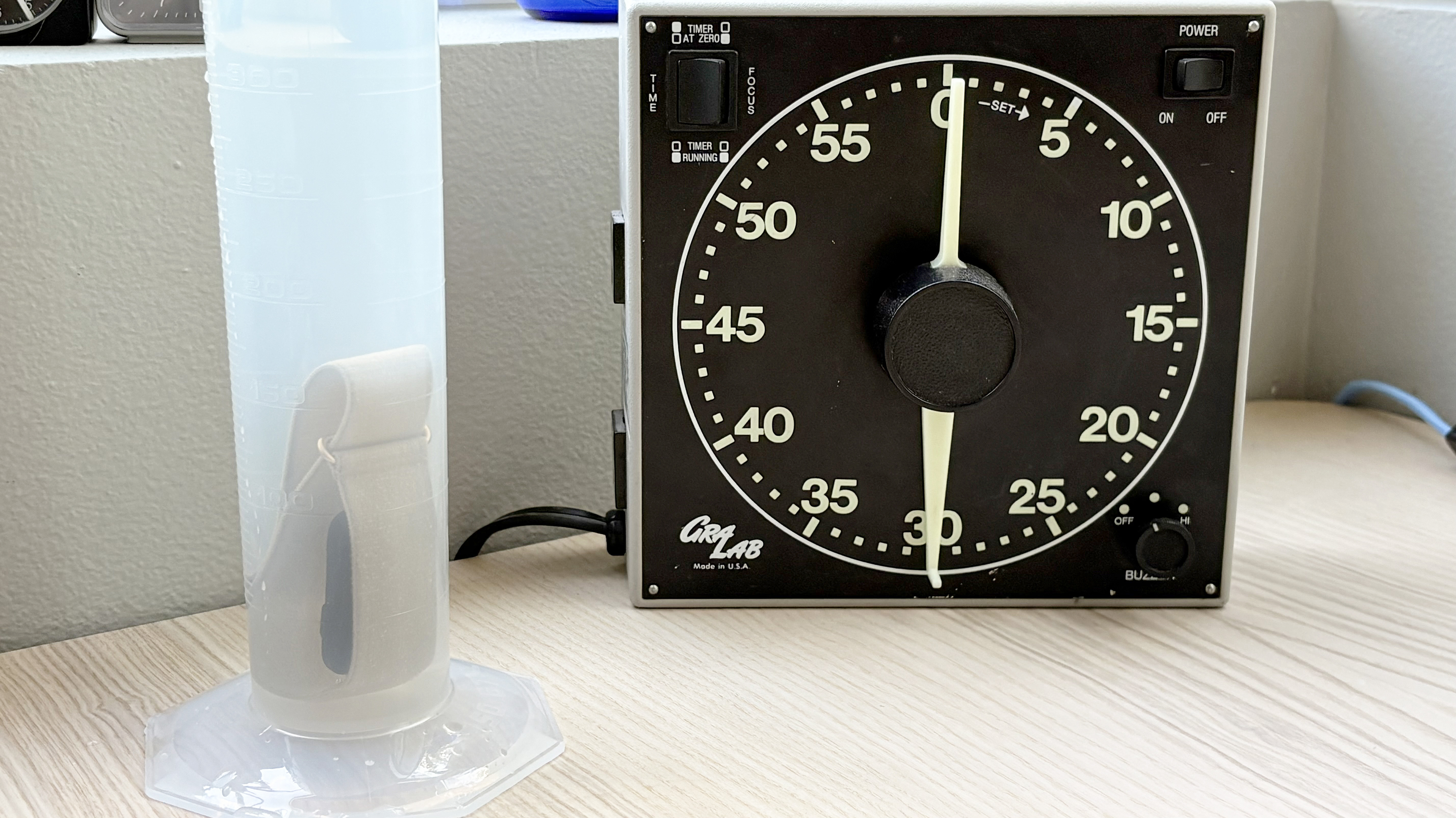 Close-up of the Garmin Cirqa fitness tracker being submerged in water to test its water resistance