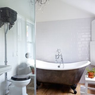 white bathroom with chandelier
