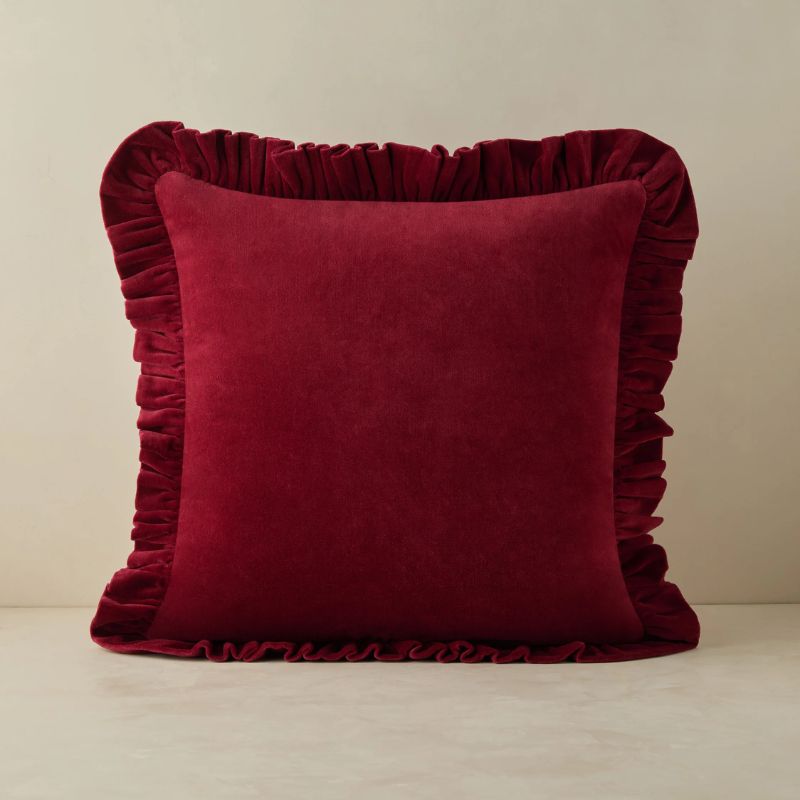dark red velvet pillow with ruffled edges