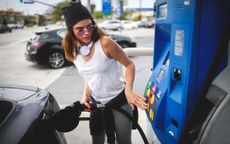 picture of woman pumping gas