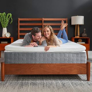 Tempur-topper supreme mattress topper couple on bed