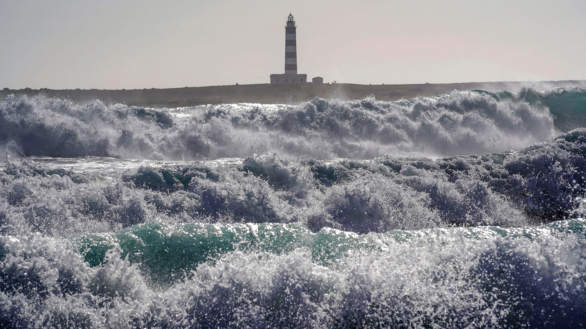 Waves caused by Storm Harry batter the coastline around Punta Prima on the island of Menorca, Spain