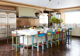 A kitchen island with tall stools
