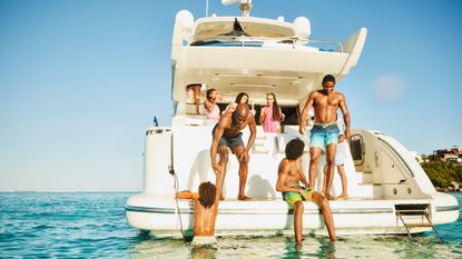 Group of people on a yacht in the Caribbean Sea during a vacation