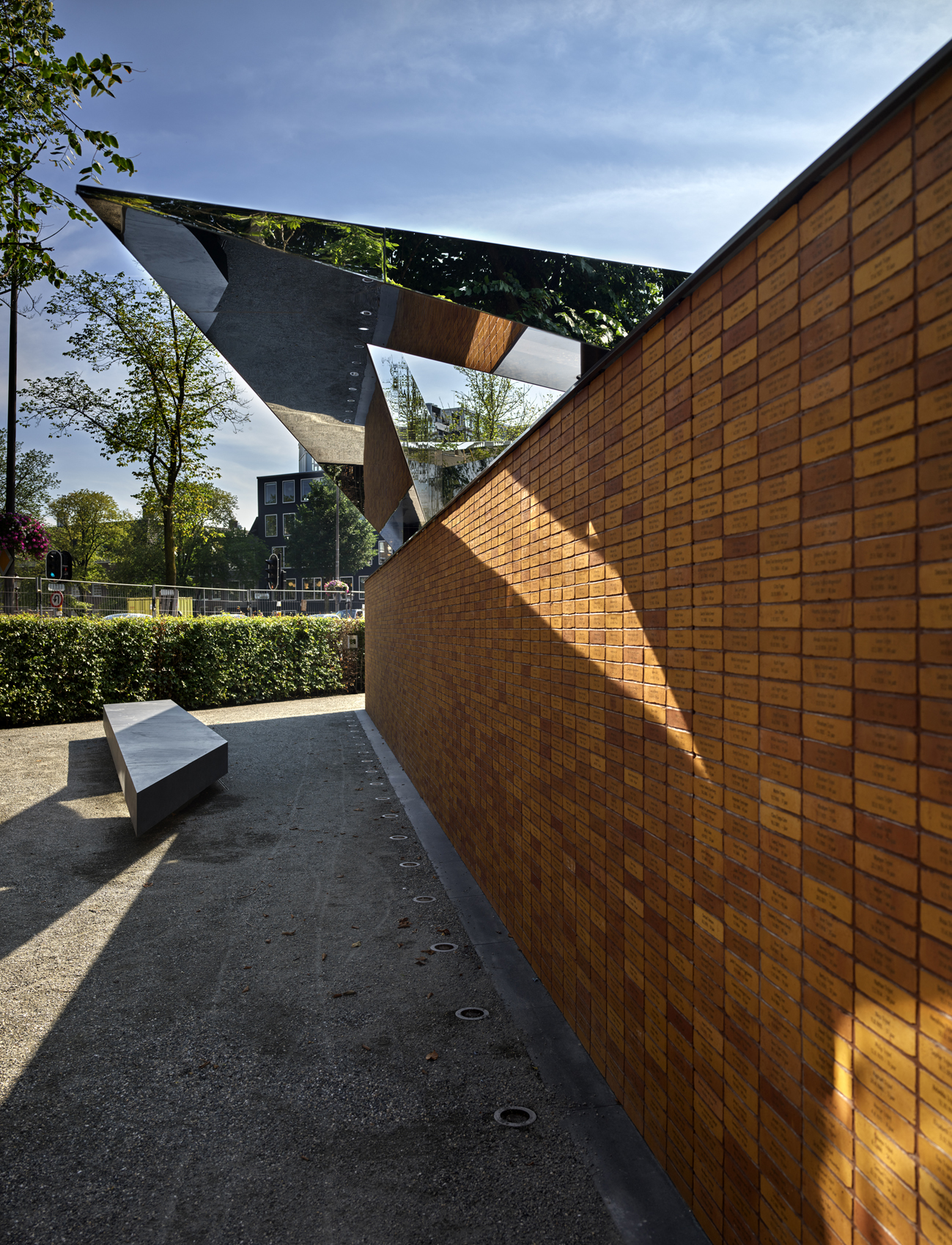 detail with mirrored angled volume at Studio Libeskind's National Holocaust Memorial of Names in Amsterdam