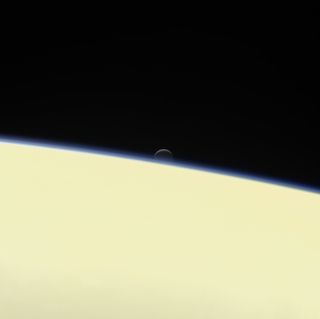 Enceladus Sets Behind Saturn