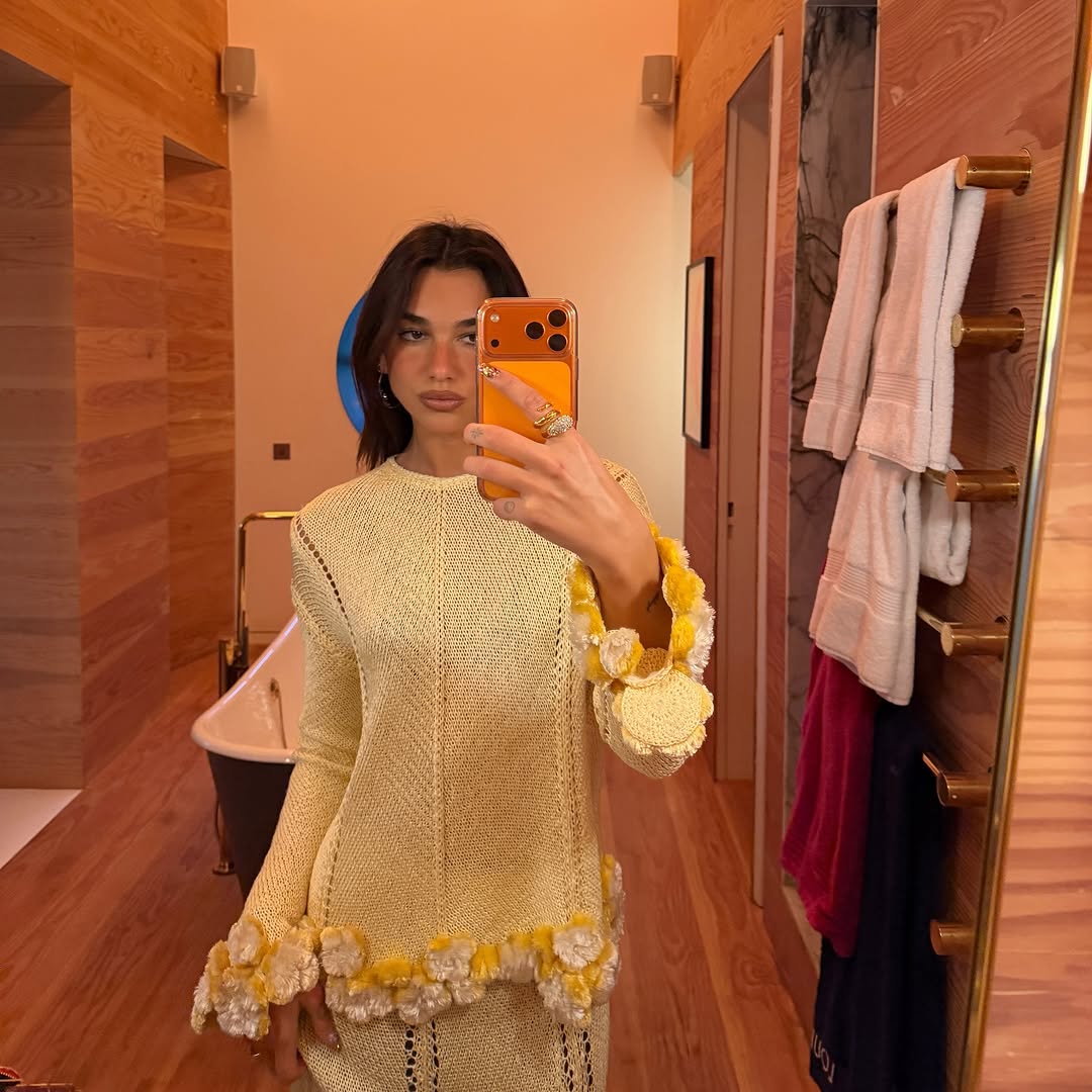 Dua Lipa wearing a butter yellow skirt set from Chanel Spring 2026