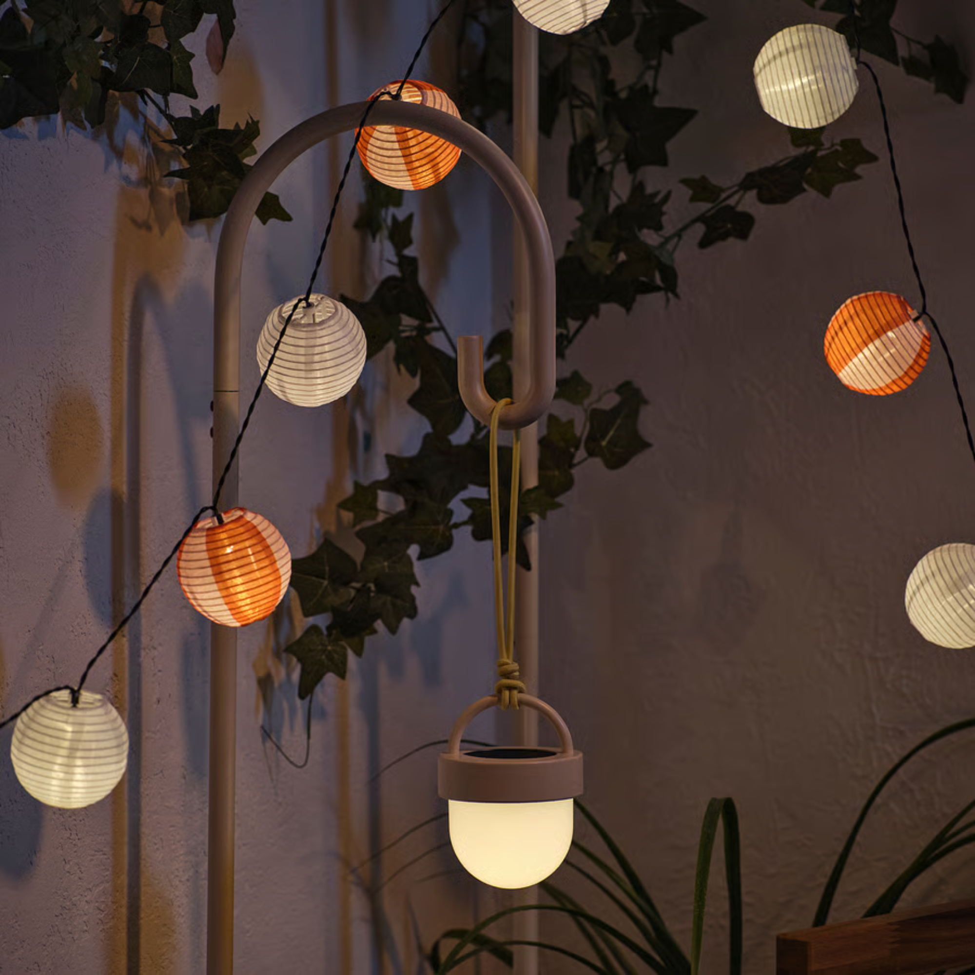 IKEA Lamp Stand holiding a white light on a piece of rope.