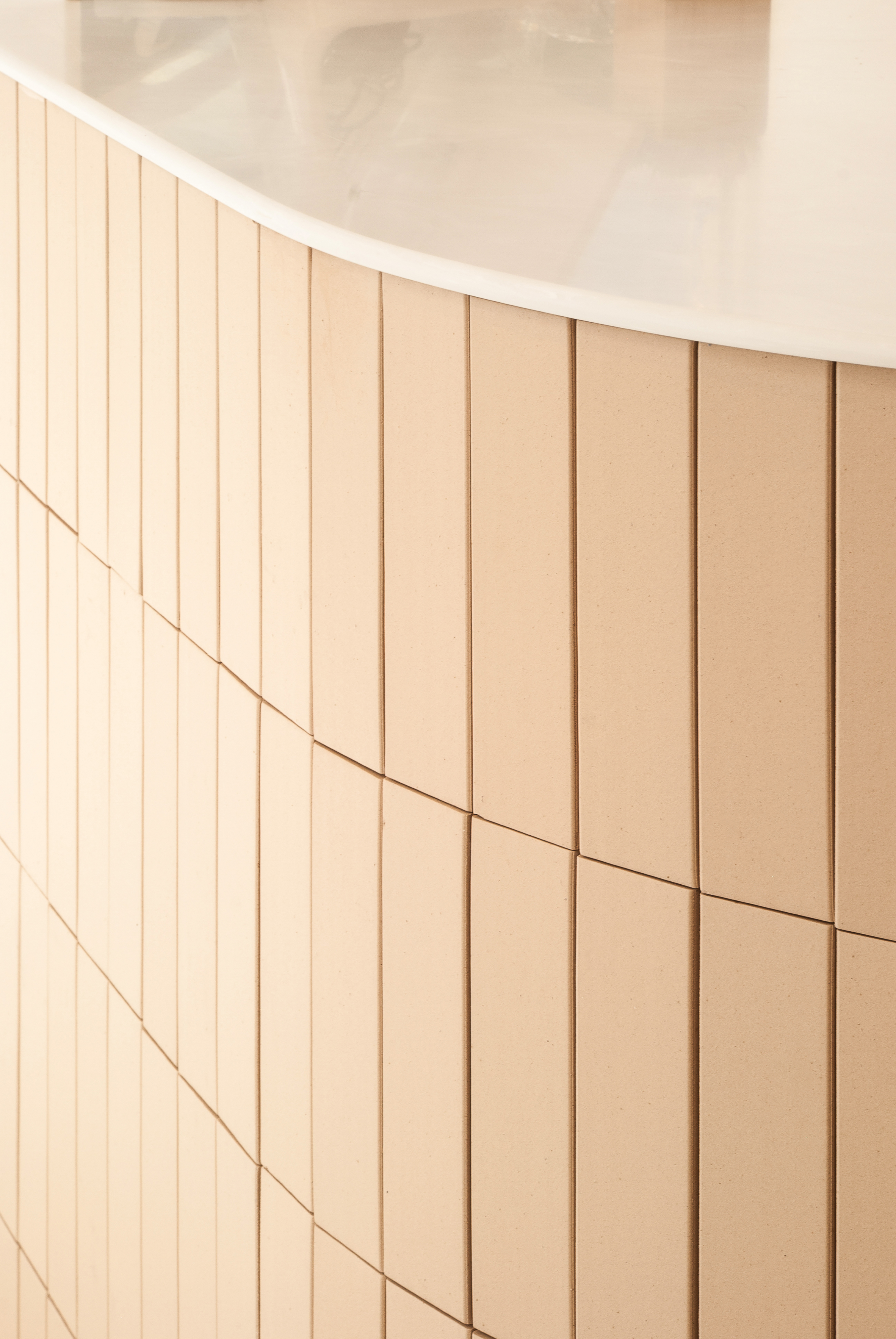 arge countertop decorated with beige tiles