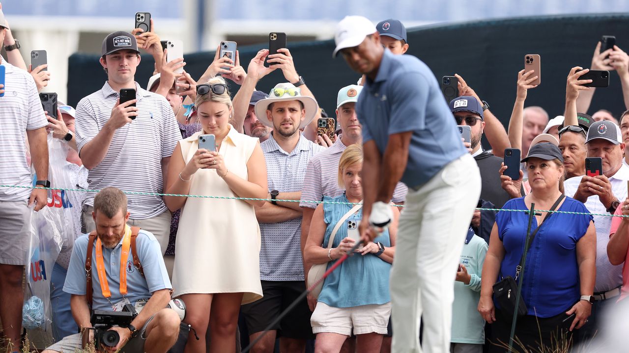 Tiger Woods sets up for a drive in front of US Open fans