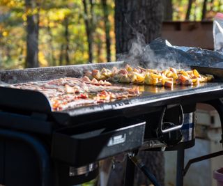A griddle outside cooking food