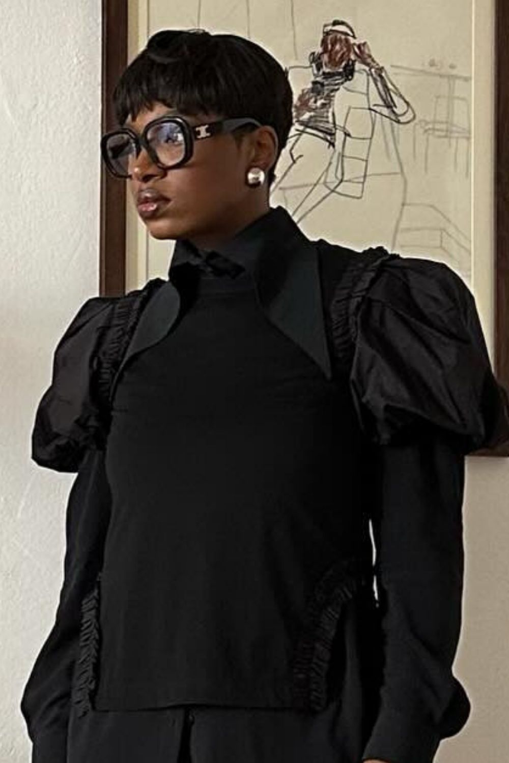 a close-up shot of a pixie haircut styled with glasses