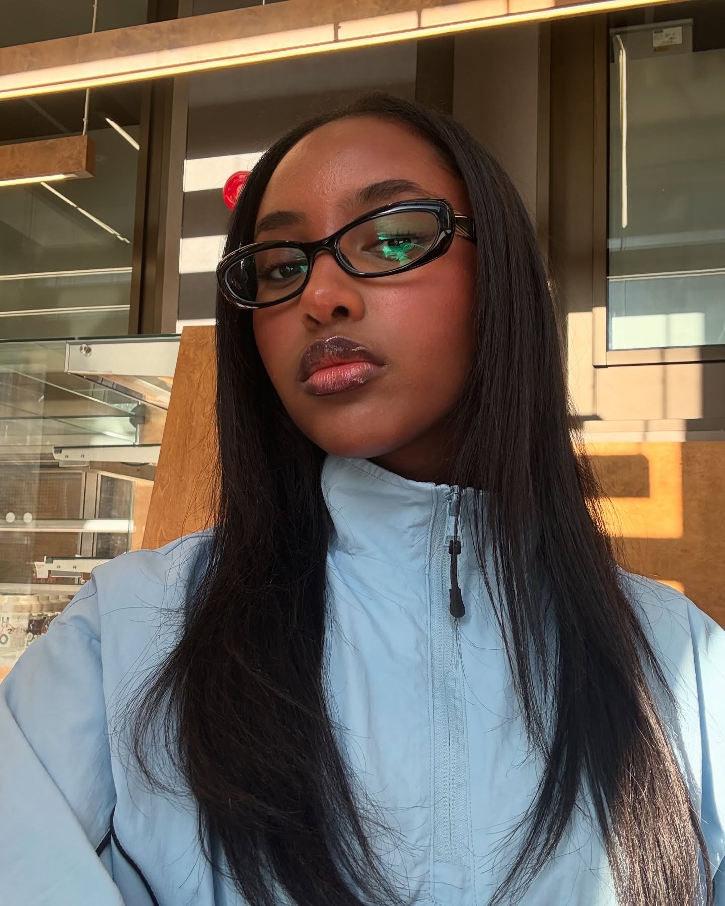 A woman with straight, flat-ironed hair.