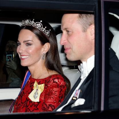 Prince William and Kate Middleton ride in a car to a reception