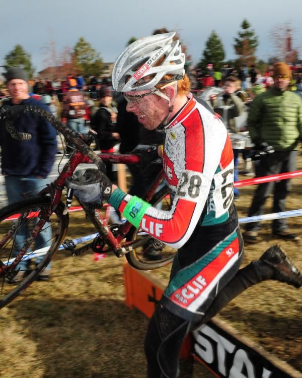 A Clif Bar rider runs the barriers.