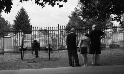 Visitors to the Soldiers' National Cemetery stand in front of the site of Abraham Lincoln's Gettysburg Address on July 2, 2013 in Gettysburg, Pennsylvania.