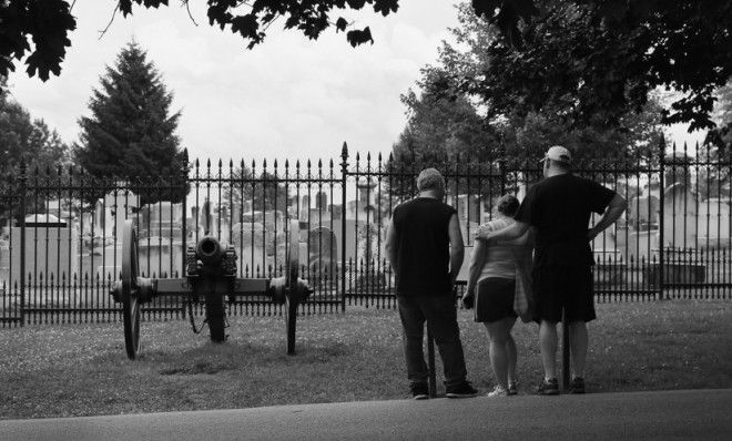 Visitors to the Soldiers&amp;#039; National Cemetery stand in front of the site of Abraham Lincoln&amp;#039;s Gettysburg Address on July 2, 2013 in Gettysburg, Pennsylvania.