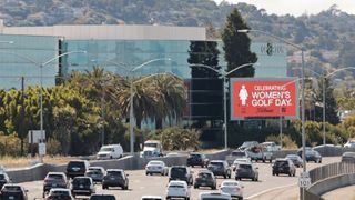 Women's Golf Day billboard on a main road in the USA