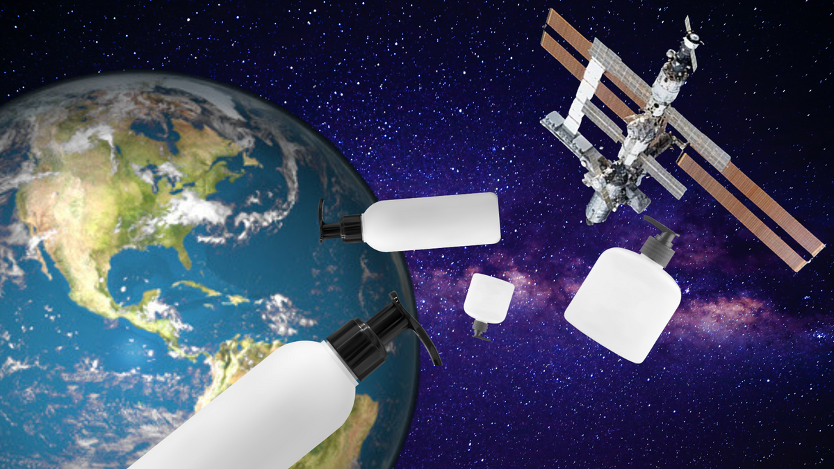 An illustration shows skincare products drifting in space with Earth and the ISS in the background