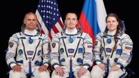 NASA astronaut Anil Menon (left) and Roscosmos cosmonauts Pyotr Dubrov and Anna Kikina, Soyuz MS-29 prime crew members, pose for a portrait at the Gagarin Cosmonaut Training Center in Russia. 