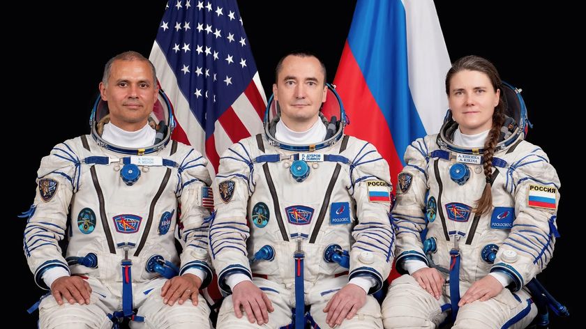 NASA astronaut Anil Menon (left) and Roscosmos cosmonauts Pyotr Dubrov and Anna Kikina, Soyuz MS-29 prime crew members, pose for a portrait at the Gagarin Cosmonaut Training Center in Russia. 