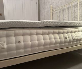 Side view of the Linenspa Mattress Topper on a mattress.