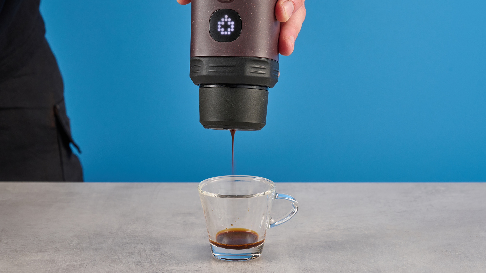 the wacaco pixapresso portable self-heating espresso maker in dark purple color showing usability with nespresso pods and ground coffee, ideal for vacations and camping