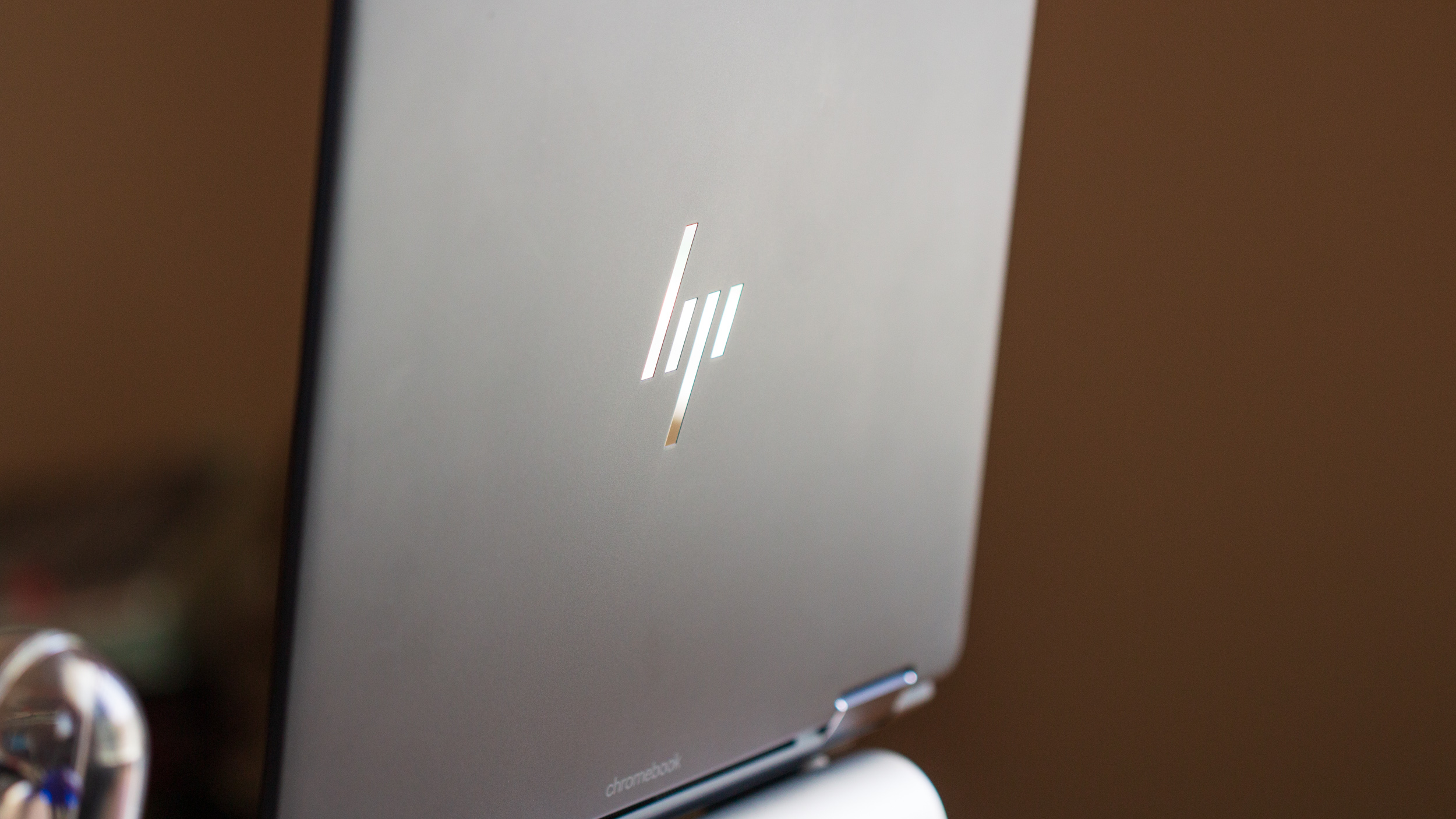 HP Elite Dragonfly Chromebook HP logo on stand close-up