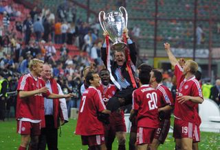 Ottmar Hitzfled holds aloft the Champions League trophy as he is lifted into the air by his Bayern Munich players following victory over Valencia in the 2001 final.