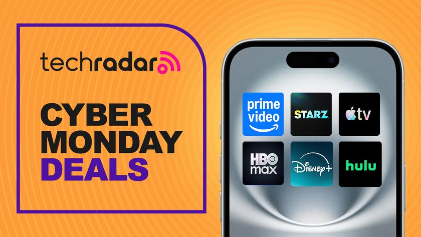 A phone with logos for many streaming services, including Prime Video, Apple TV, Hulu and HBO Max, with a sign saying Cyber Monday deals