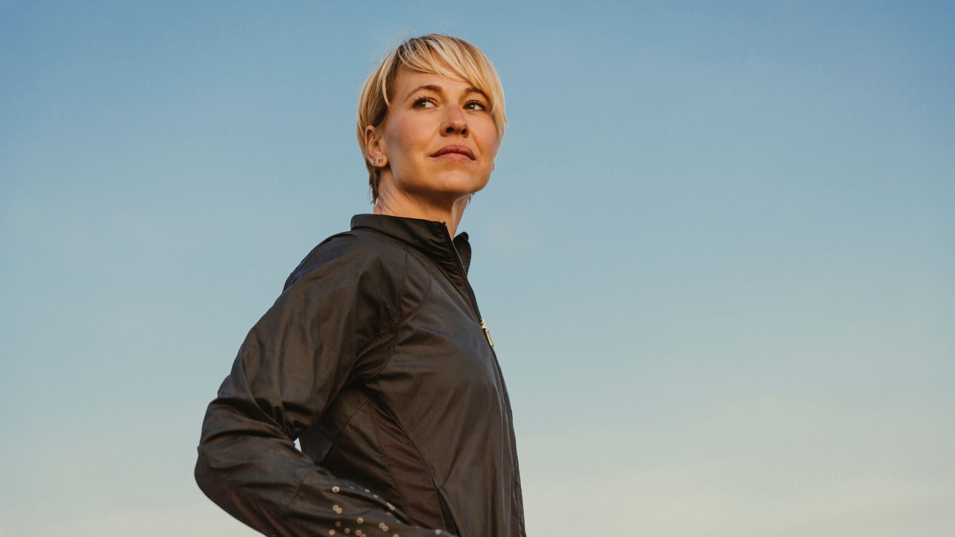 Woman wearing activewear against sky